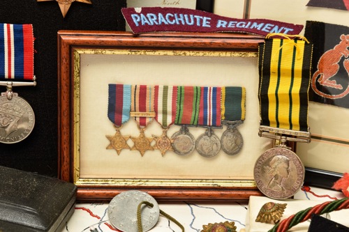 The miniature WW2 medals of Harold Merton’s brother Leslie Hugh Merton, comprising the 1939-45 Star, Africa Star with 1st Army bar, Italy Star, Defence Medal, War Medal and Territorial Efficiency Medal. Pictured to the right of the miniatures is the Africa General Service Medal awarded to Harold Merton’s son, Richard, a 2nd lieutenant with the 9th Devonshire Regiment.