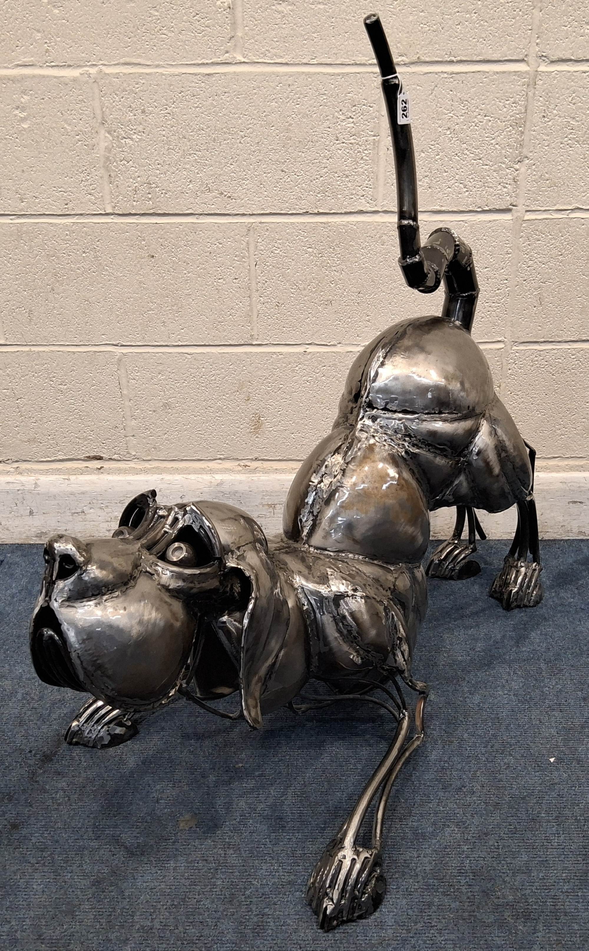 Metal sculpture of playful hound sold £320.jpg