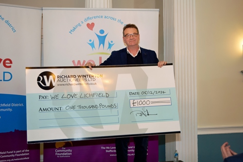 Richard Winterton presented We Love Lichfield with £1,000 at the Christmas Giveaway.