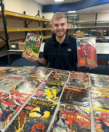 James Winterton with some of the collection of comics.