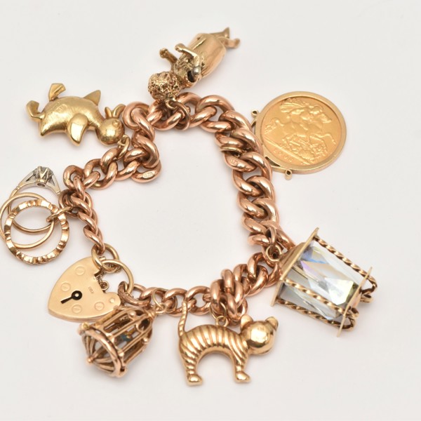 9ct gold charm bracelet sold £1,700.jpg