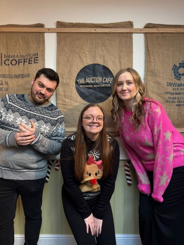 Happy first birthday! The Auction Café manager Emma Dermody with colleagues Ben Palmer and Kimberley Kenyon.