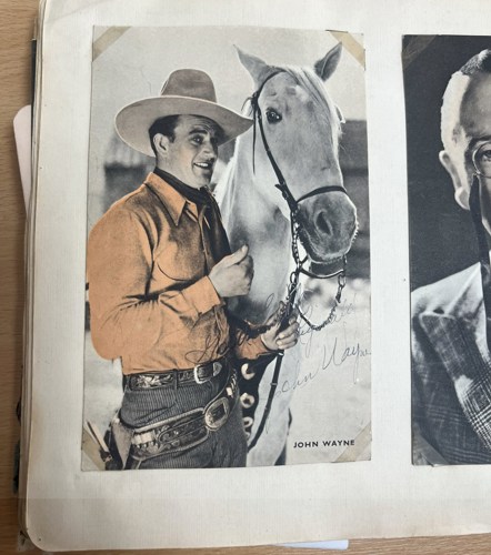 An early promo photo signed by John Wayne.