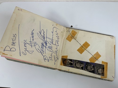 John Lennon, Paul McCartney, George Harrison and Ringo Starr signed after a gig in 1963. Affixed next to the autographs is George’s guitar string snapped that same night.