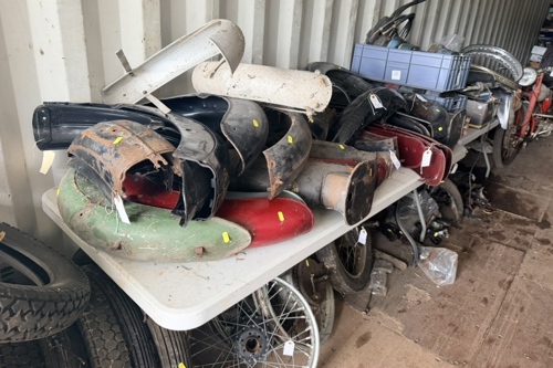 Motorcycle parts including mudguards.