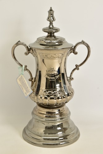 The uncanny FA Cup replica, crafted from ceramic with a platinum glaze by Portmeirion Pottery.