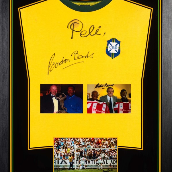 Framed Seleção Brasileira de Futebol number 10 shirt signed by Pelé and Gordon Banks sold £1,700.jpg
