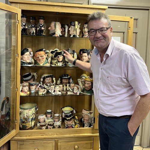 Auctioneer Richard Winterton with some of the collection of character jugs.