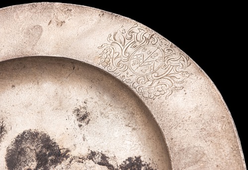 The silver plate is engraved with Sir Cloudesley’s coat of arms.