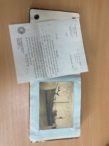 The signed photo of Girl Pat shows the vessel moored on the Demerara River in Georgetown and is accompanied by letters from Captain Orsborne’s solicitors.