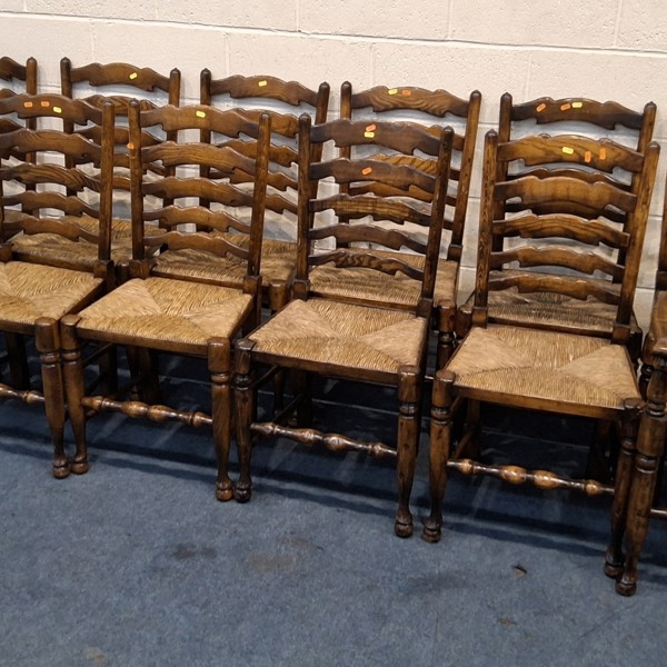 12 oak-framed rush-seated ladder back chairs sold £500.jpg