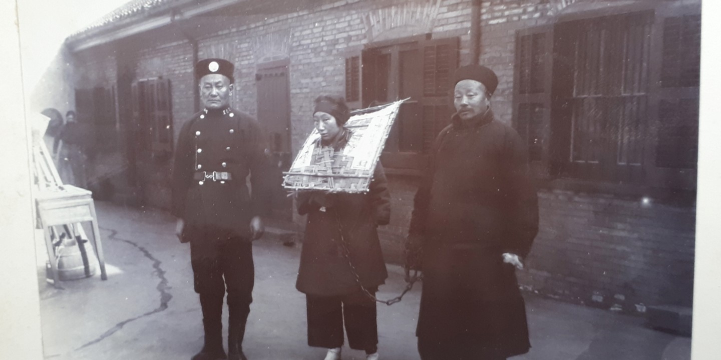 Police With Prisoner In Cangue Device