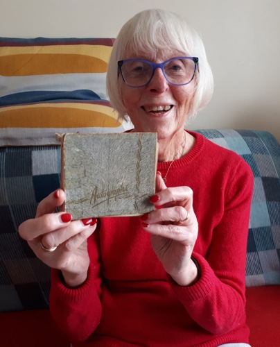 Elizabeth Salt with her autograph album.