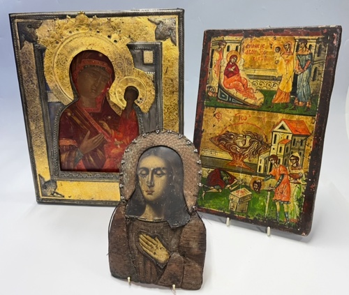Front centre, a linen with copper needlework icon; left, an icon with a mixed metal oklad; right, one created from tempera on wood.
