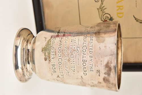 This silver tankard by Walker & Hall, Sheffield, is inscribed: “Presented by the National Coal Board to Mr WH Joiner for bravery in the pit Walsall Wood Colliery 9th October 1956.”
