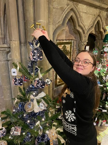 Emma adds the finishing touch – a golden gavel topper.