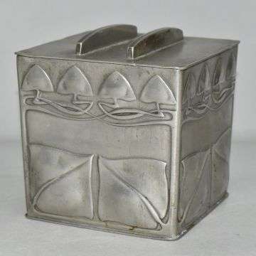 This Liberty Tudric pewter biscuit box designed by Archibald Knox sold at £850.