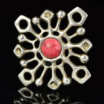 A snowflake brooch by David Andersen which sold at auction for £150.