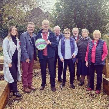 Gnosall won the BKVC 2023 Large Village Community Award. members of the community are pictured with county sponsor Richard Winterton and Jo Cooper, BKVC manager at The Community Foundation.